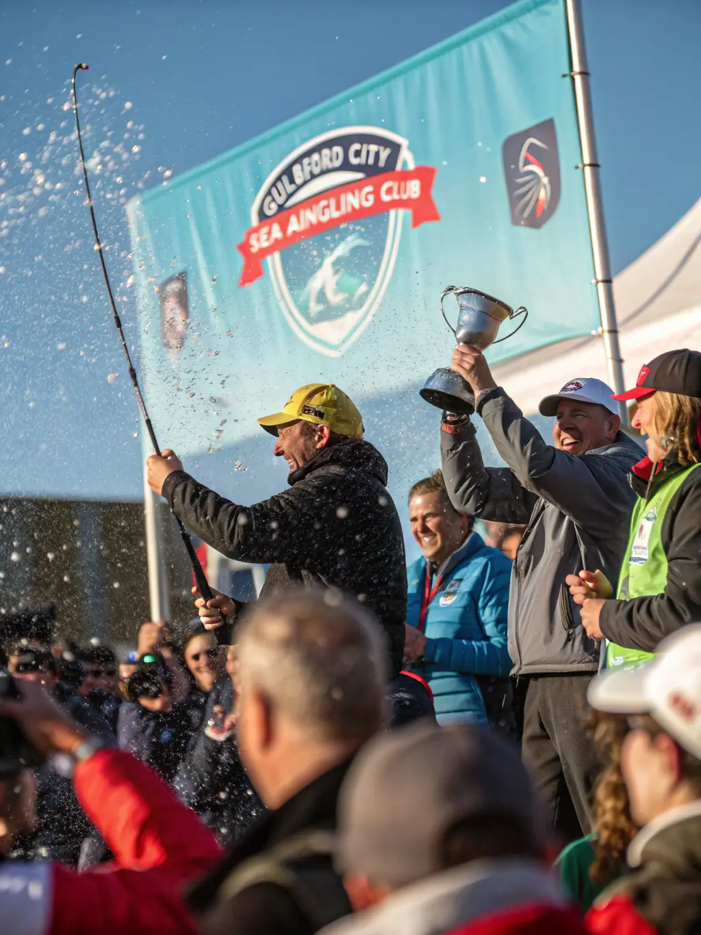 A group of anglers participating in a friendly fishing competition at the Blyes pond, showcasing the camaraderie and sportsmanship of AMICALE DES PECHEURS DE BLYES.
